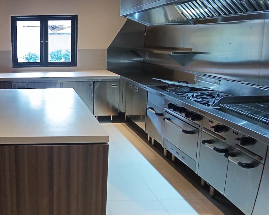 kitchen with Brandon griddle, fryer,exhaust hood